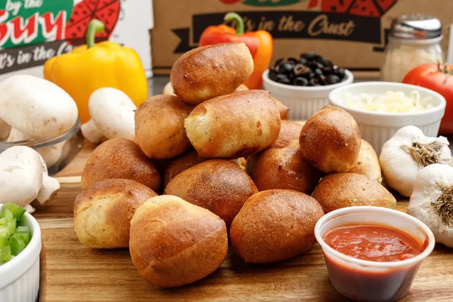 Bread bites with garlic butter and red garlic sauce