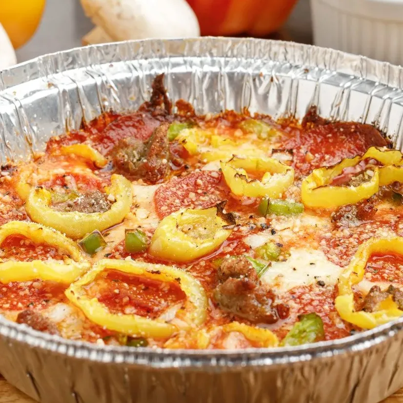 A crustless pizza baked in a tin pan